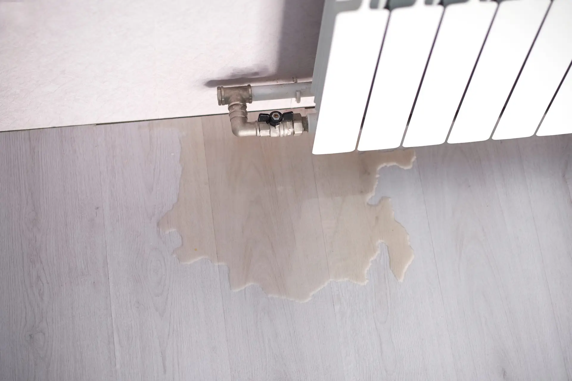 Water,Leak,Through,The,Heating,Radiator,Tube,Nut.,Water,Leaking